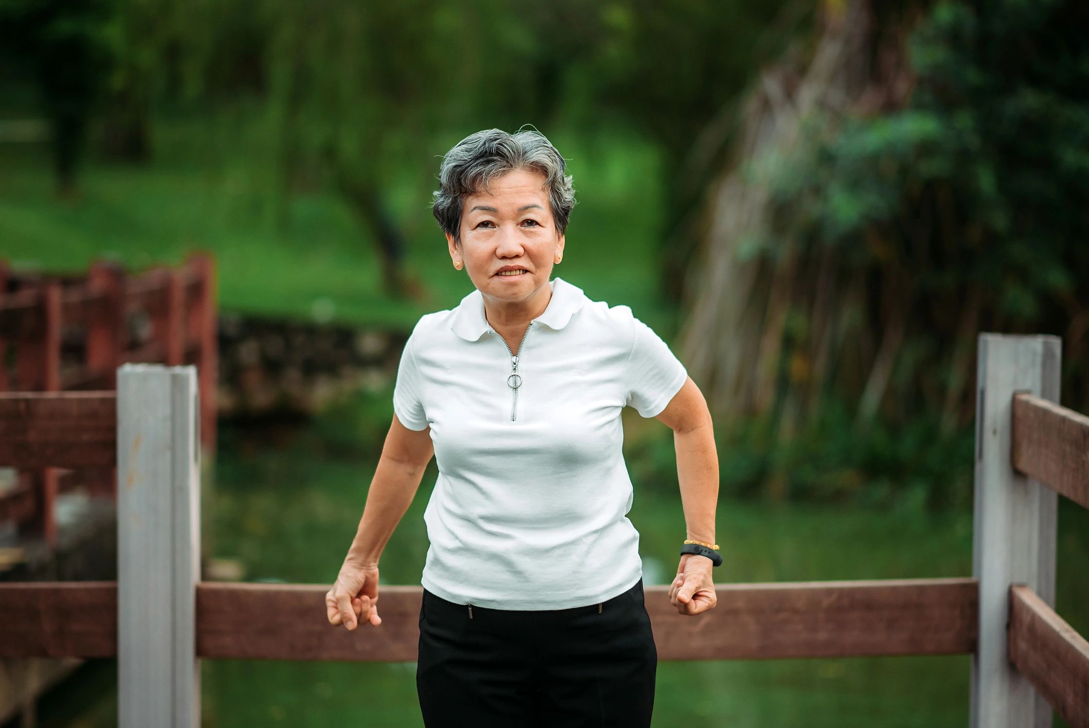 Active senior woman stretching outdoors