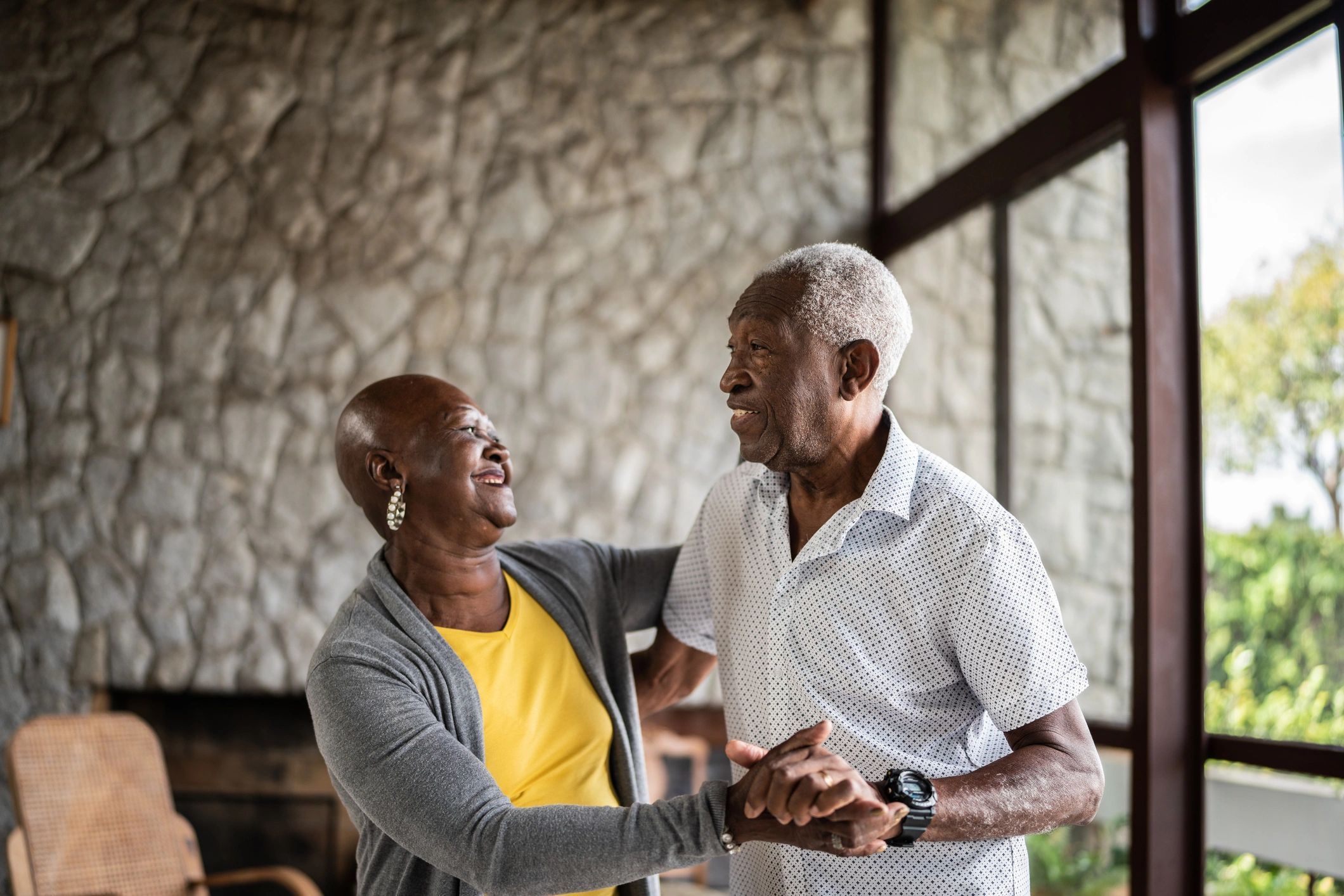 Smiling older adult couple representing satisfied customers