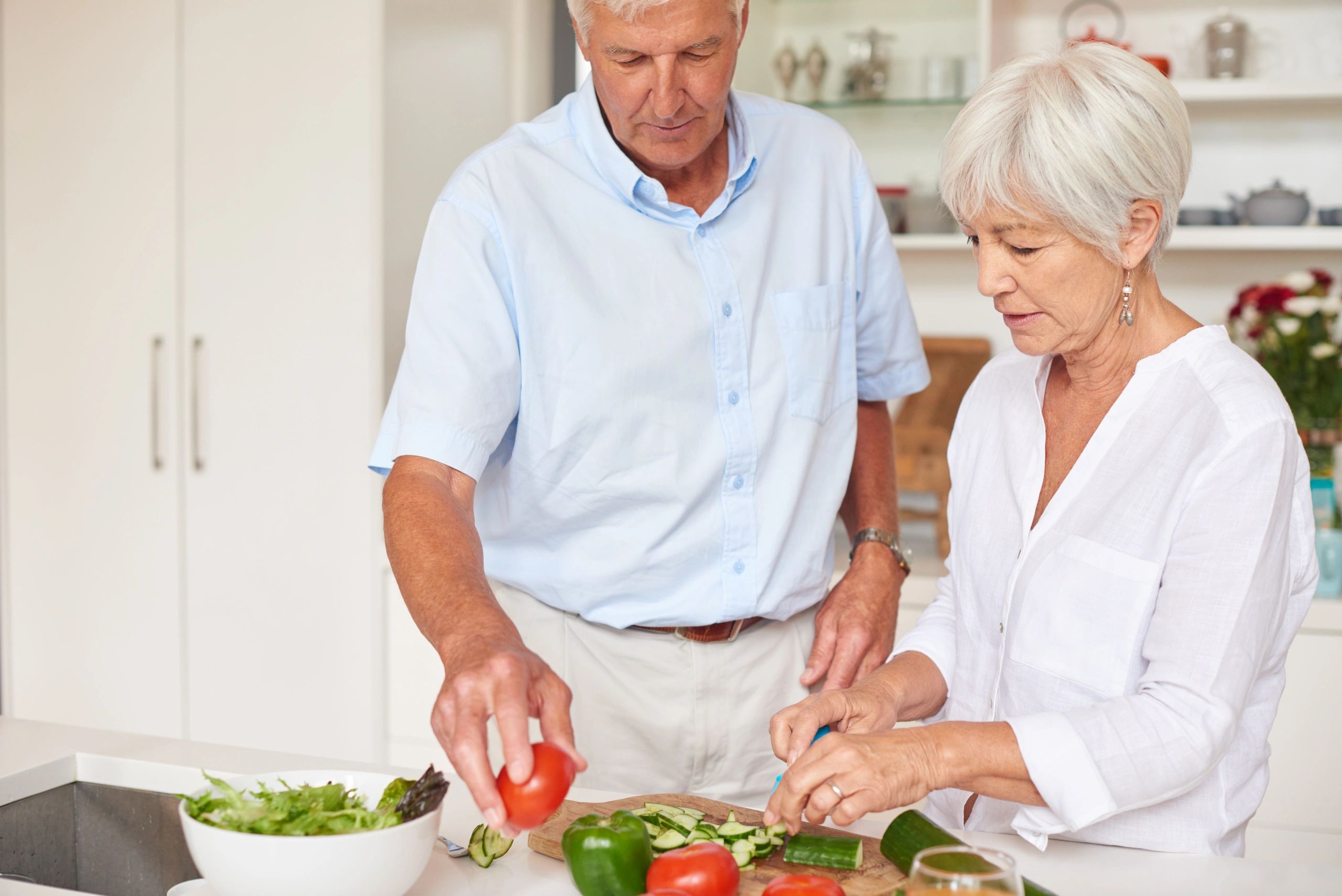 Senior couple preparing a healthy meal together in the kitchen