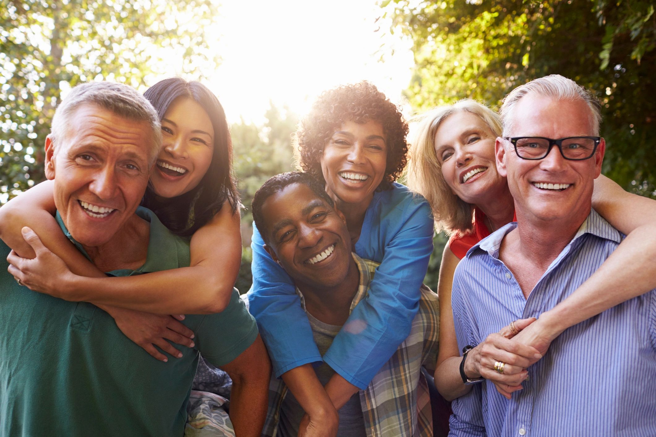 Happy older friends enjoying time together outdoors